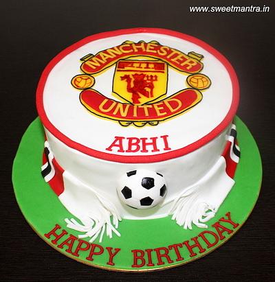 MANU logo cake - Cake by Sweet Mantra Homemade Customized Cakes Pune