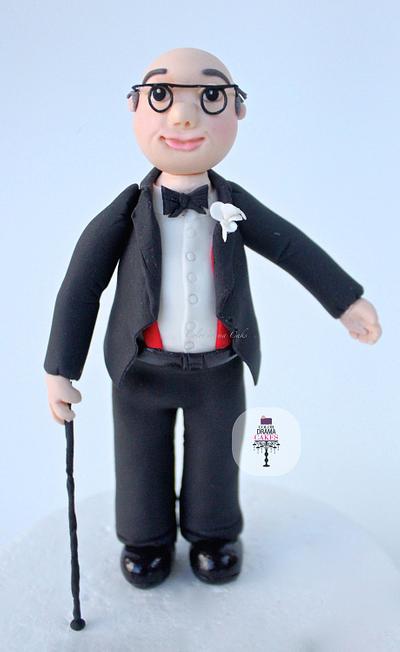 Figurine cake topper.  - Cake by Color Drama Cakes