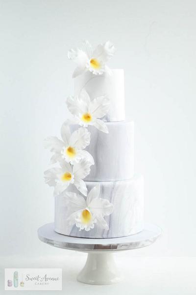 Marble wedding cake with orchids cascade - Cake by Sweet Avenue Cakery
