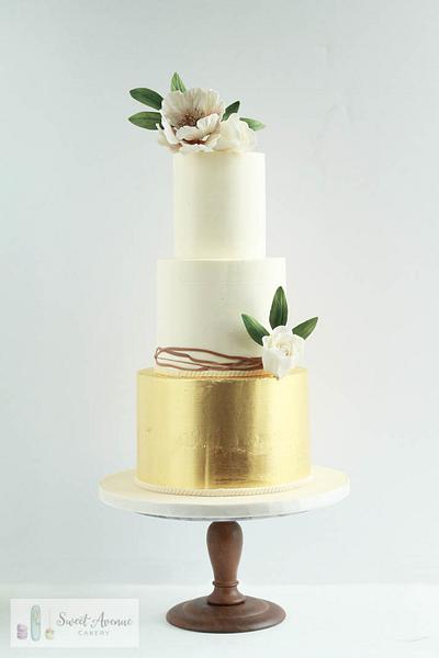 White and gold wedding cake with gold foil and flowers - Cake by Sweet Avenue Cakery