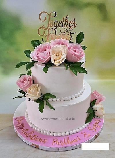 2 tier Wedding cake with fresh flowers - Cake by Sweet Mantra Homemade Customized Cakes Pune