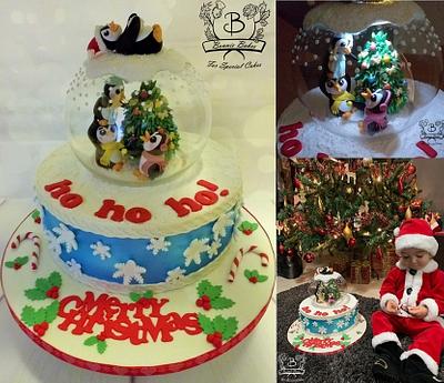 Snow globe Christmas cake with penguins - Cake by Bonnie Bakes UAE
