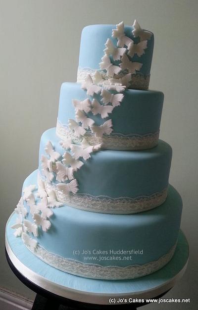 Wedgwood Blue 4 Tier Wedding Cake with Ivory Butterflies - Cake by Jo's Cakes