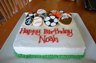 Sports theme birthday cake with cookie toppers - Cake by bakedbyrachel