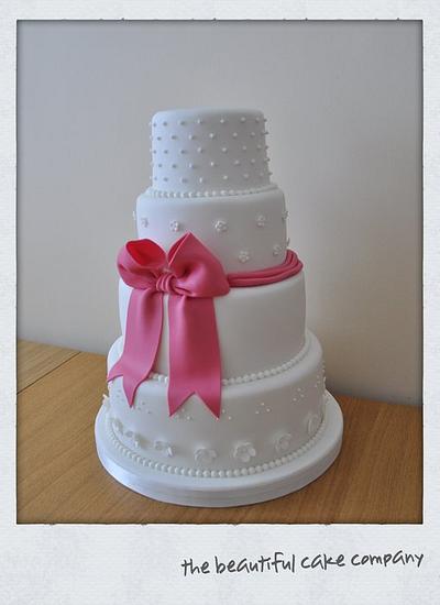 Pink bow wedding cake  - Cake by lucycoogancakes