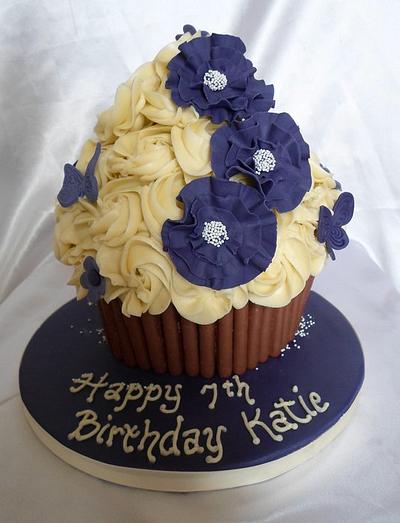 Giant Cupcake with ruffled flowers - Cake by Carrie-Anne Dallas