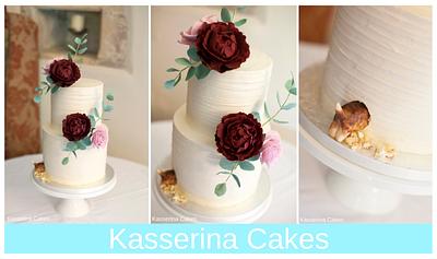 2 tier buttercream cake with sugarpaste flowers and naughty pup - Cake by Kasserina Cakes