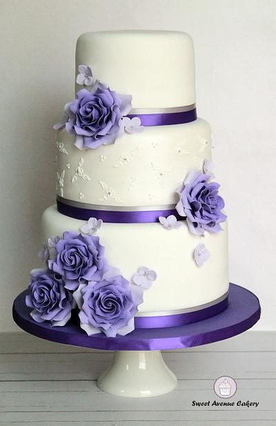 Elegant white and purple wedding cake - Cake by Sweet Avenue Cakery