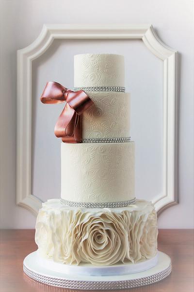 rose gold bow and white ruffles - Cake by the cake outfitter