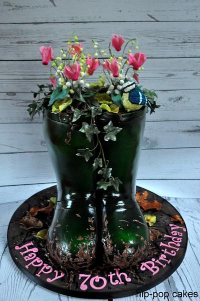 Wellies with lily of the valley & cyclamen - Cake by Lesley Marshall cake art
