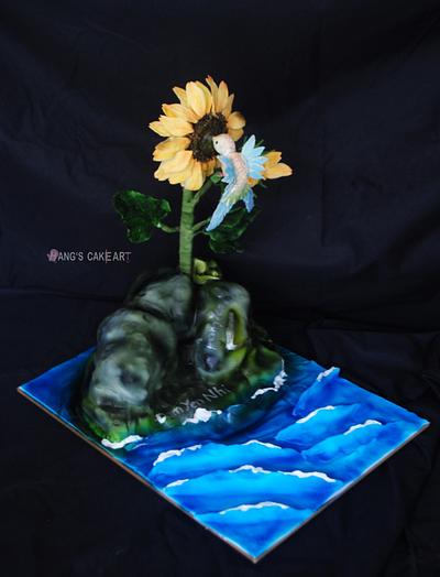 The Humming bird and the Sunflower grew up on the rock. - Cake by Hanghuynh