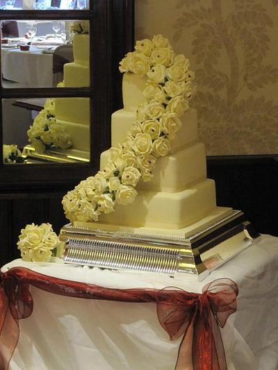  ivory wedding with a hint off burgandy  - Cake by d and k creative cakes