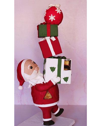 Anti gravity Santa carrying parcels cake. - Cake by Edibleelegancecakeszim Youtuber