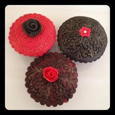 Black and red embossed cupcakes.  - Cake by cssweetsntreats