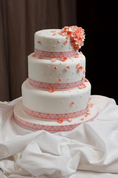 Coral blossom and pearl cascade wedding cake with coral ribbon and lace overlay - Cake by Kathryn
