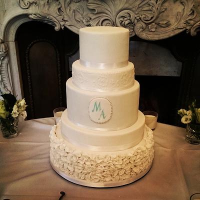 Wedding cake with ruffles, cameo and piping.  - Cake by Divine Bakes