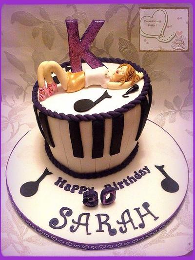 Kylie Minogue model topper on a Wonky purple piano cake - Cake by Emmazing Bakes