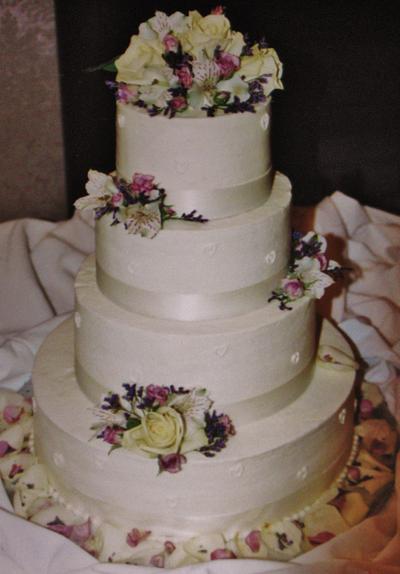 4-tier buttercream with small BC hearts - Cake by Nancys Fancys Cakes & Catering (Nancy Goolsby)