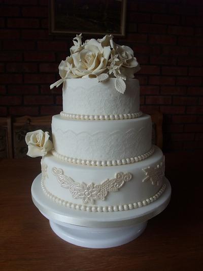 Pearls and Lace in ivory and white with handmade fondant roses  - Cake by The Stables Pantry 