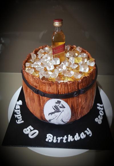 Gorgeous Birthday chocolate cake lavishly decorated with bonbons and  sweets, with bottle of strong alcohol on the top. Gift for a young man  Stock Photo - Alamy