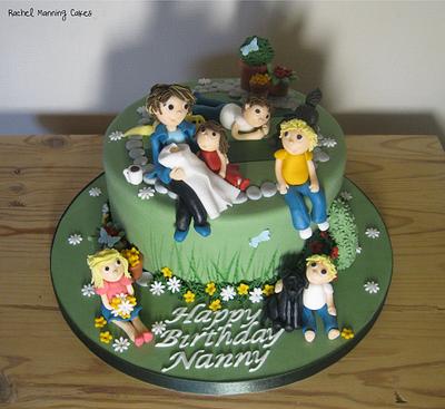 Nanny in the garden with her 6 grandchildren & 3 dogs! and a cuppa ;) - Cake by Rachel Manning Cakes