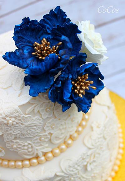 a royal blue and lace wedding cake and cupcakes  - Cake by Lynette Brandl