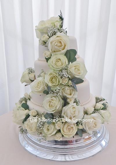 Ivory wedding cake with real flowers - Cake by The Billericay Cake Company