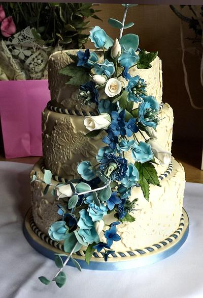 Ivory lace with blue hydrangea, sweet pea, and eucalyptus sugar flowers wedding cake :) x - Cake by Storyteller Cakes