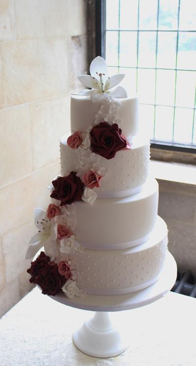 Rich red roses and lilies.  - Cake by Cherish Cakes by Katherine Edwards