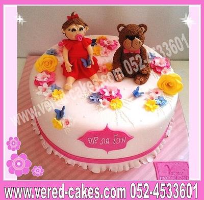 A teddy-bear and a baby in a field of flowers - Cake by veredcakes