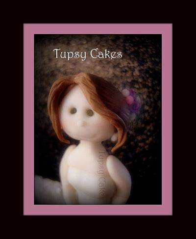 working on bride cake topper - Cake by tupsy cakes