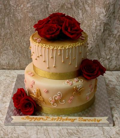 Golden cake with red roses - Cake by The House of Cakes Dubai