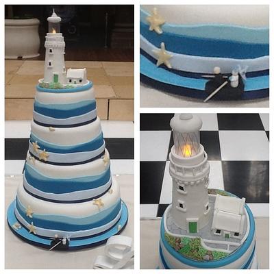 Nautical themed wedding cake with lighthouse topper - Cake by Tickety Boo Cakes