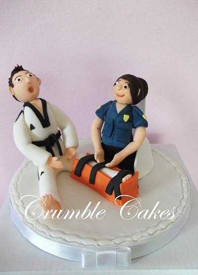 Cake topper for a paramedic bride and a karate instructor groom  - Cake by CrumbleCakes