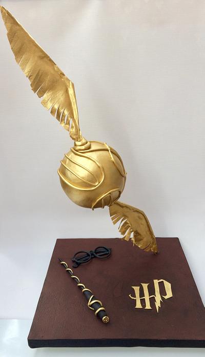 Gravity defying Golden Snitch  - Cake by lorraine mcgarry