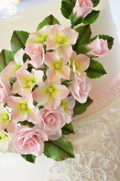 Hydrangeas, roses and lace. - Cake by Hilary Rose Cupcakes