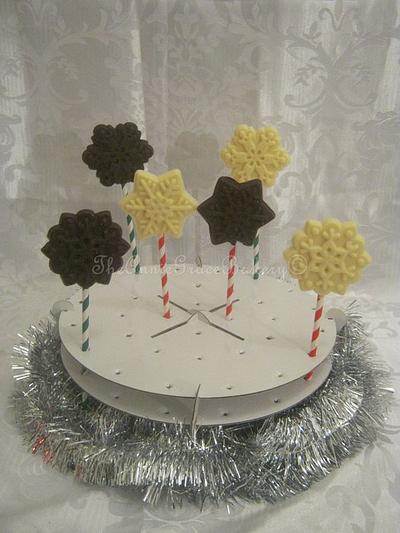 Yummy Belgian chocolate snowflake lollies. - Cake by The Annie Grace Bakery