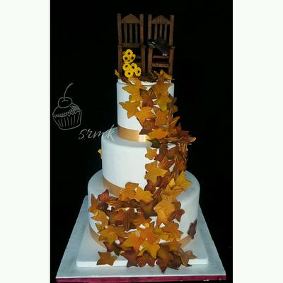 autumn theme wedding cake with rocking chair topper - Cake by Srikanth kakarlamudi