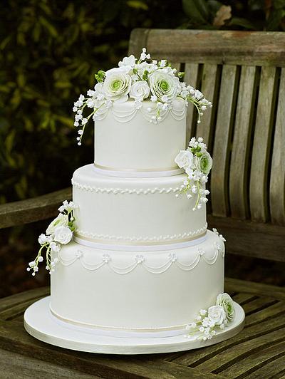 White Wedding Cake with ranunculus, roses and lily of the valley - Cake by ClearlyCake