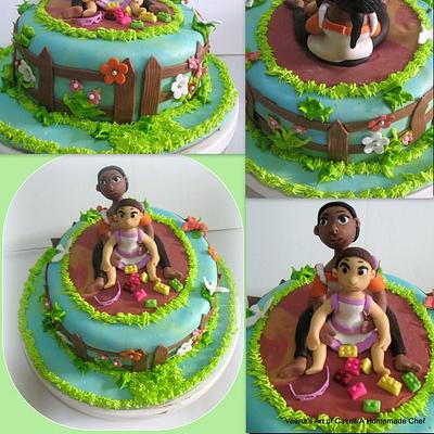 A Garden Theme Cake with mother and daughter suar models. - Cake by Veenas Art of Cakes 