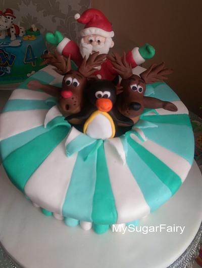 Santa & Co Exploding from a cake. - Cake by MySugarFairyCakes