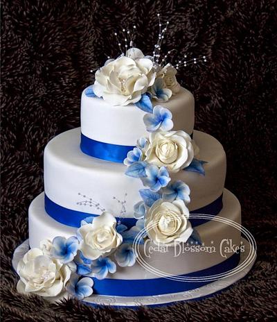  Blue and white roses and frangipanni cake - Cake by ozgirl39