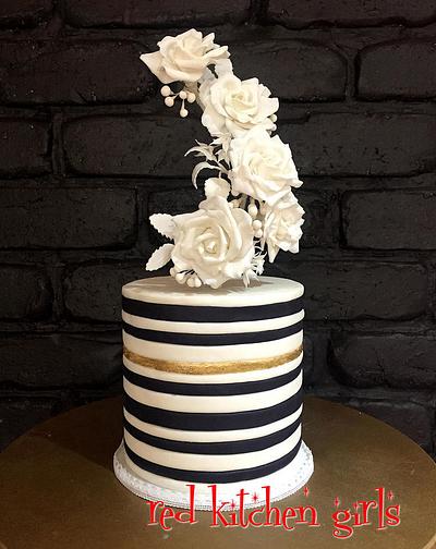 Elevated flowers on a striped cake - Cake by Zoe Byres