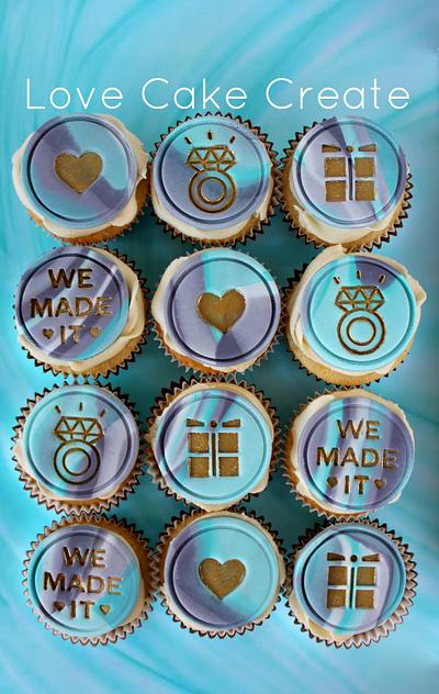 Engagement Cupcakes with Grey and Turquoise marbled fondant and gold detailing - Cake by Love Cake Create