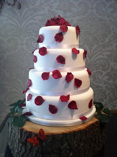 Scarlet scatter petal wedding cake - Cake by Nina Stokes
