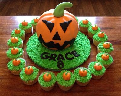 Pumpkin cake with matching cupcakes  - Cake by SweetDelightsbyIffat