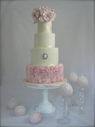 Four Tier Ruffle Wedding cake with 10 pretty cakes balls - decorated in royal icing to match the cak - Cake by Jac