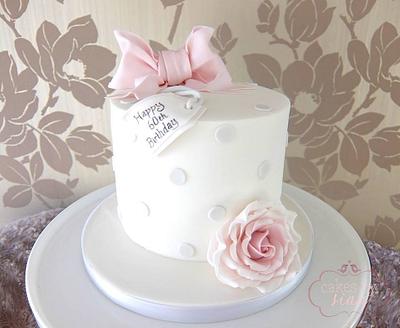 Polka dots and bow birthday cake - Cake by Cakes by Sian
