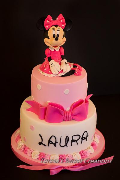 It's pink and ... has a pretty bow!......Polka Dot & Pink Minnie Mouse First Birthday Cake  - Cake by teresasweetcreations