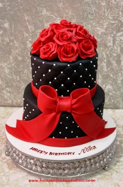 Black cake with red roses - Cake by House of Cakes Dubai